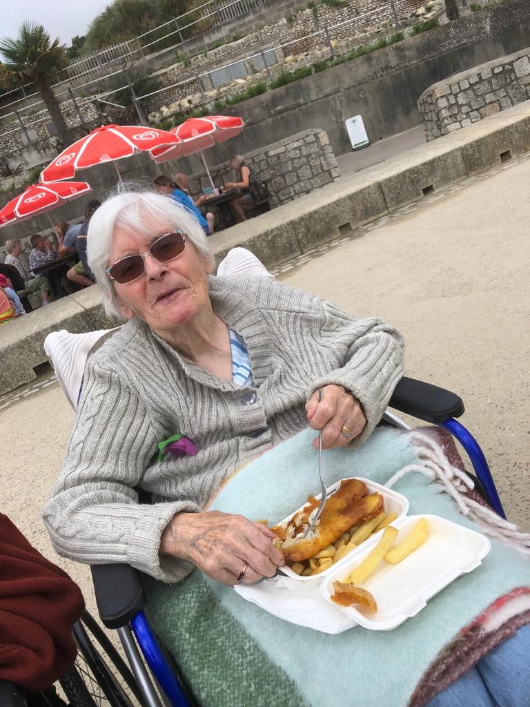 Resident enjoying fish and chips