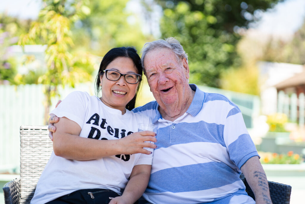 Care team member Desiree Longley with resident Ron Letheren at The Old Rectory, Exeter