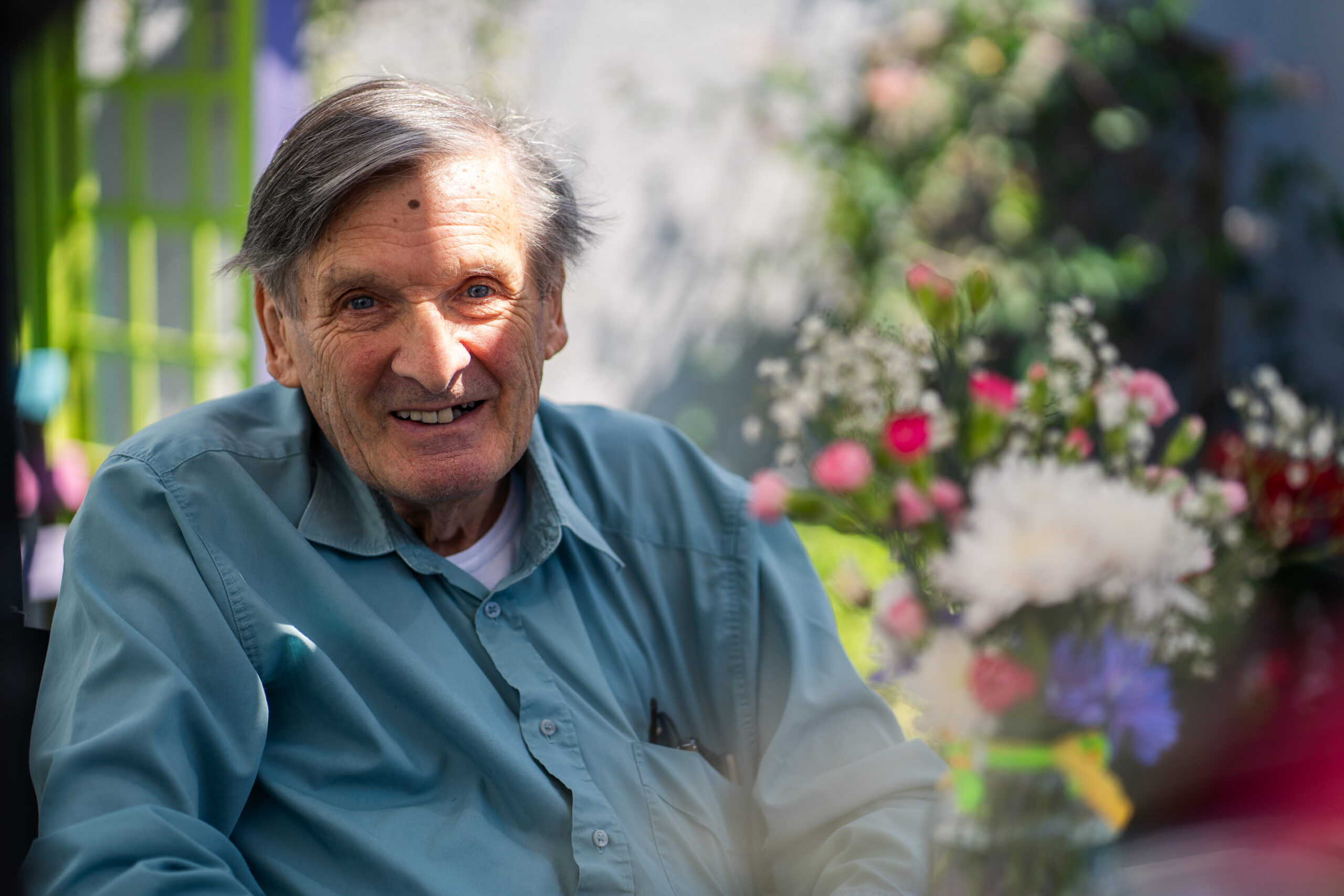 Care Home Fees in England - Eldery gentleman looking at the camera with the sun shining on him