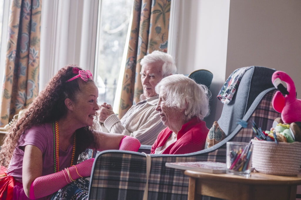 Parkwood House activities coordinator Kerrie Haughey with two residents in the Parkwood House lounge