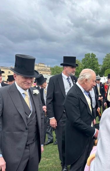 King Charles greets guests at the Royal Garden Party. Among them were Geoffrey Cox and Margot Whittaker from Southern Healthcare.