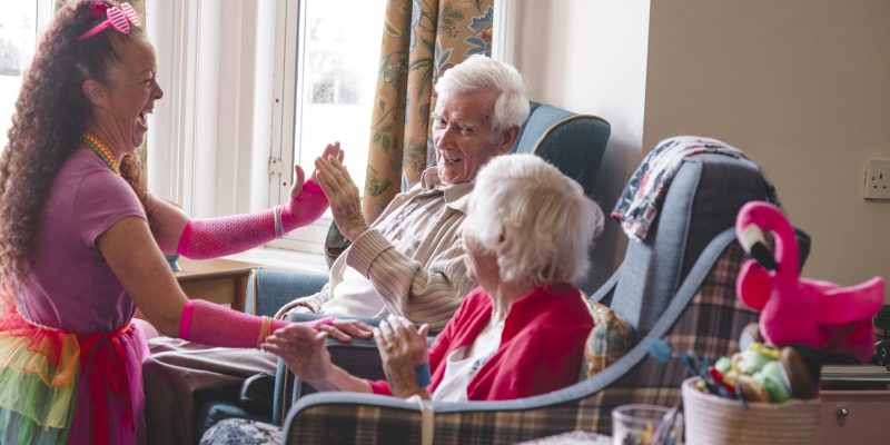 Activities coordinator Kerrie Haughey with residents in the lounge at Parkwood House.