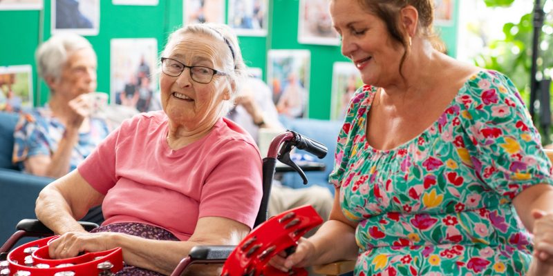 Sefton-Hall-resident-Shirley-Mapston-with-care-team-member-Julie-Yates in the lounge